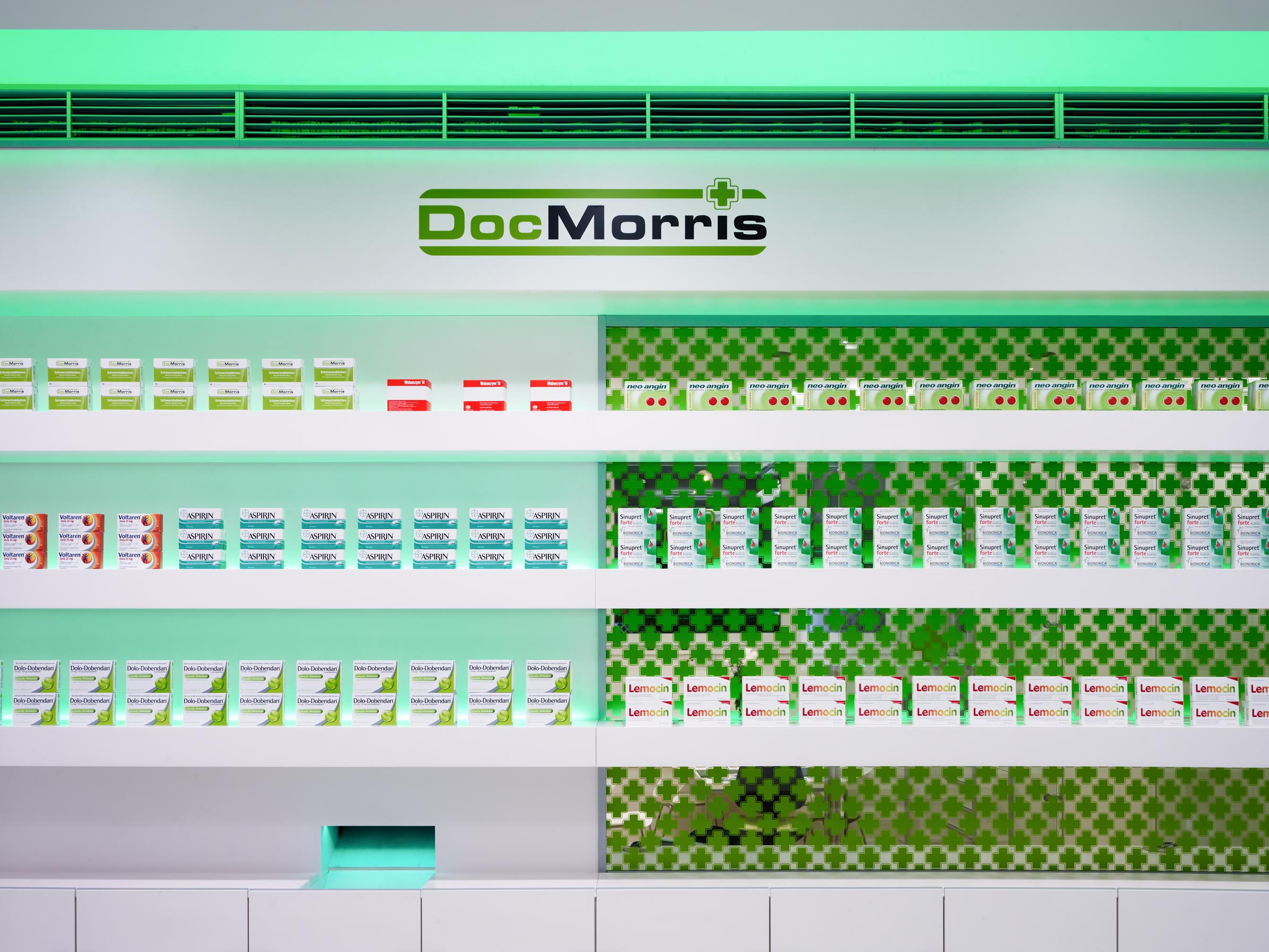 Medicine display with green lighting accents
