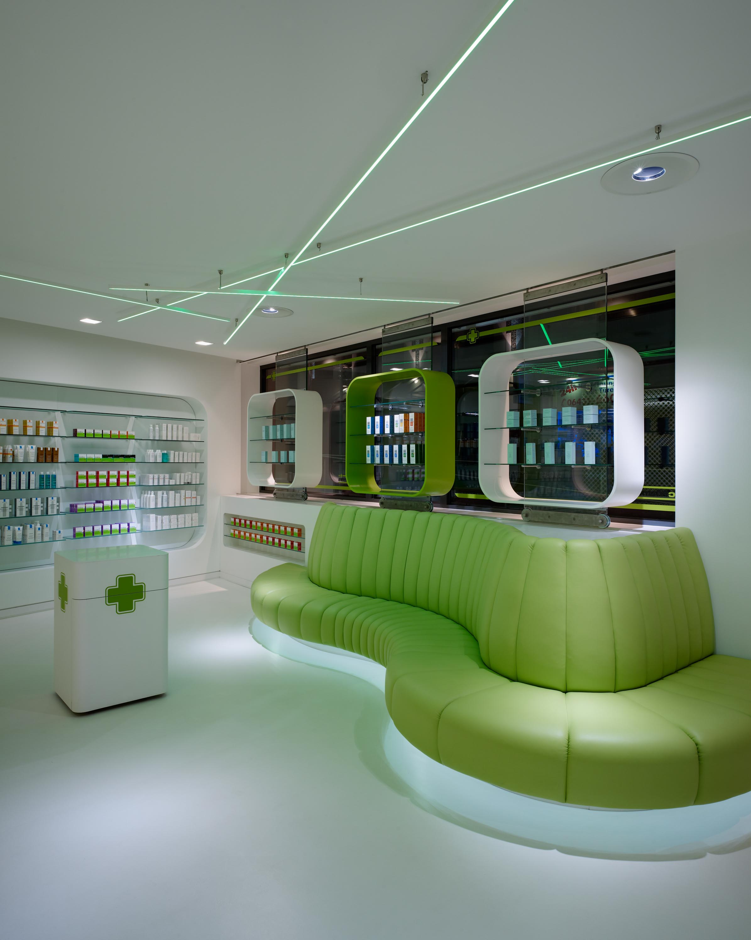 Waiting area with curved sofa and illuminated sculpture