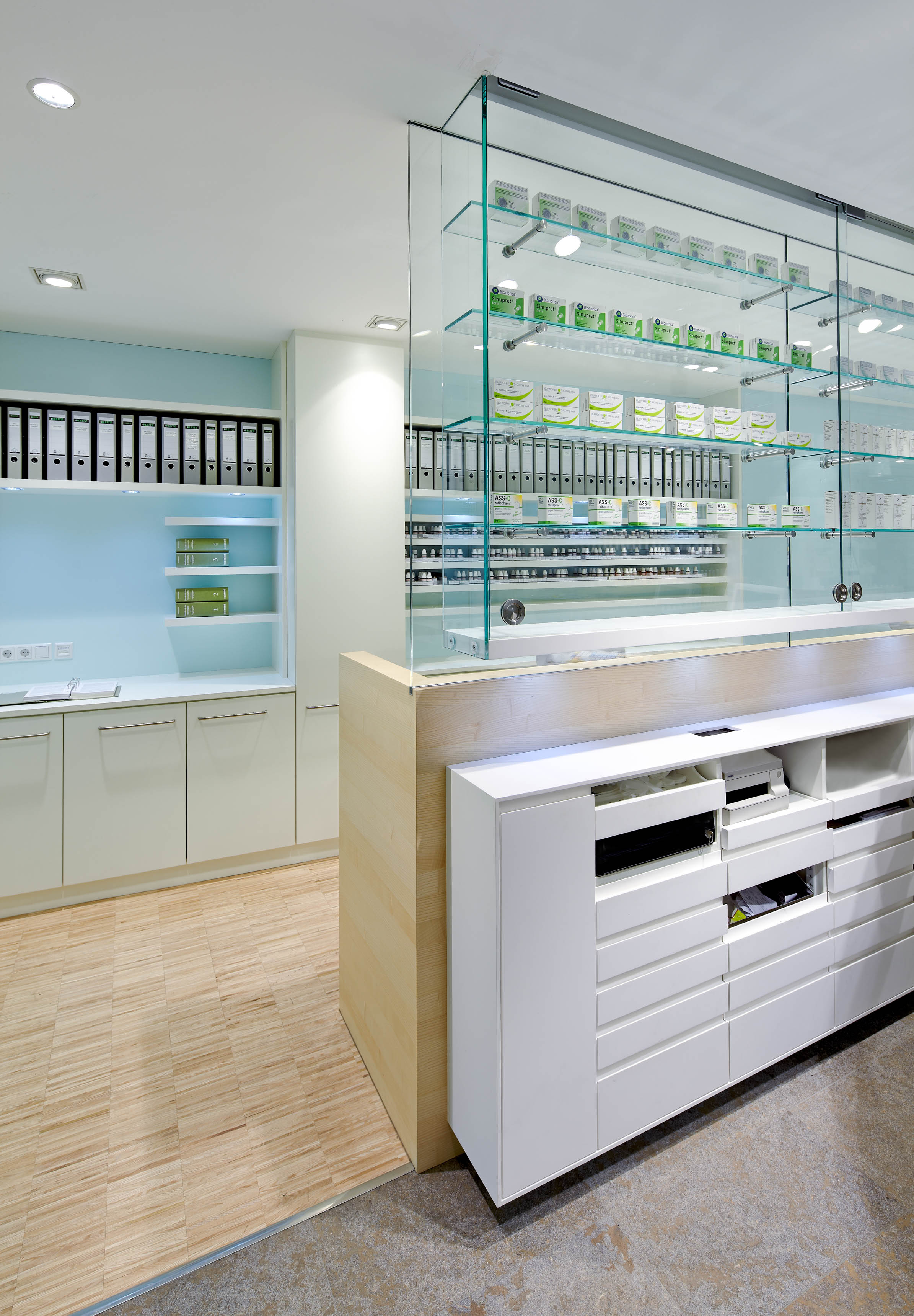Glazed medicine display with a view into the working area