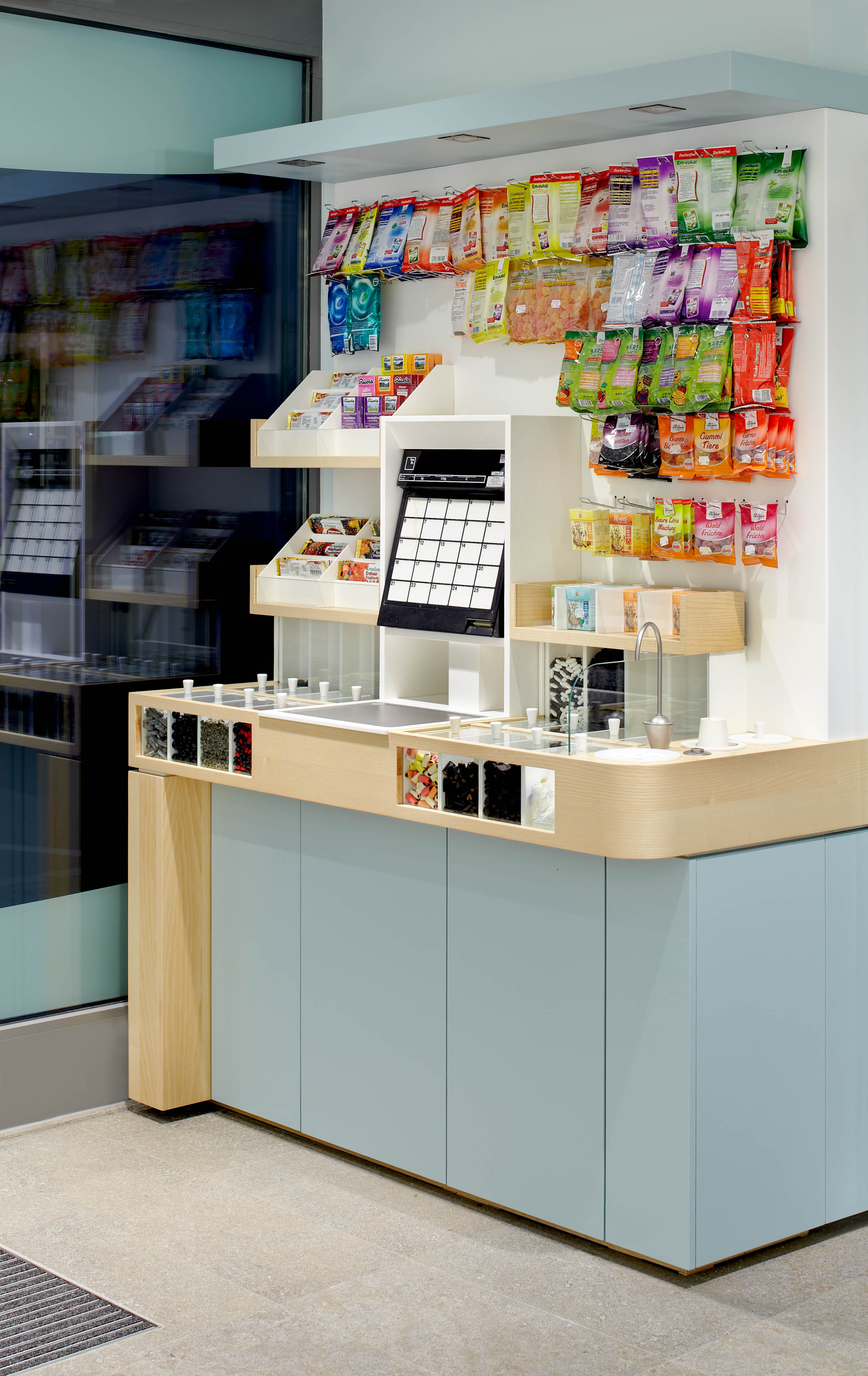 Self-service liquorice bar with scales and water dispenser